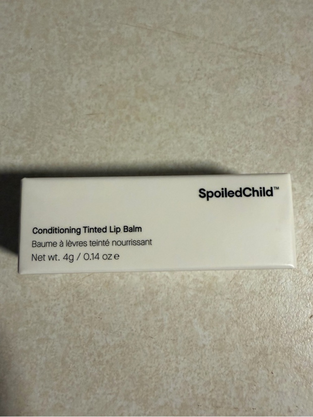 SpoiledChild Conditioning Tinted Lip Balm - brand new. Color: PLUM